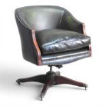 A green leather upholstered swivel desk chair, on a splayed base