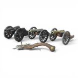 A collection of model canons, together with a model crossbow (4)