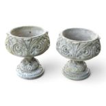 A pair of cast stone pedestal garden urns, 50cm high (2)