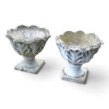 A pair of cast stone garden urns, of pedestal form, 40cm high (2)