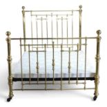 A Victorian style brass double bed frame, with a padded base 153w x 205d cm