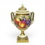 A Royal Worcester porcelain twin handled vase and cover, shape 2363, painted with fruit by John H.