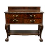 A four drawer mahogany sideboard in the manner of Waring & Gillow, the moulded top with piecrust