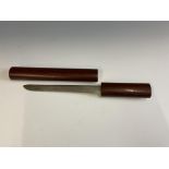 A Japanese Aikuchi Dagger, oval form hardwood bipartite scabbard, the top with copper mounted tear-