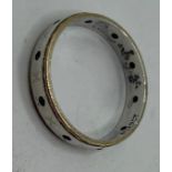 Small Silver ring with thin gold band to each edge Size O-P, marked SIL 9ct and has pat 1310897