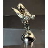 A "Rolls Royce Spirit of Ecstasy" chrome figure, on domed base, ht. 9cm.