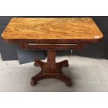 William IV flame mahogany swivel top card table with green baize in good condition on bun feet.