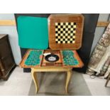 A decorative inlaid and marquetry work games table with a double sided removable top with green
