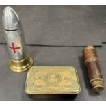 A WWI Red Cross coin box fashioned from an artillery shell, a Kelvin and Hughes telescope, a brass