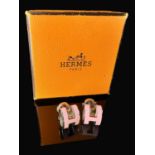A pair of Hermes Paris Mini Pop H earrings, Palladium plated with Rose Dragee enamel, with