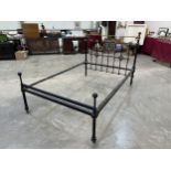 A 4ft6in Victorian brass and iron bedstead