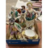 A Staffordshire cow and milkmaid group, three continental porcelain figures and a Dresden cup and