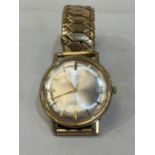 A 9ct cased Rotary gentleman's wristwatch, the frosted dial with date aperture, on plated