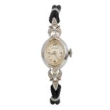 WITTNAUER, FOURTEEN CARAT WHITE GOLD AND DIAMOND COCKTAIL WATCH