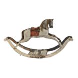 An English carved wooden rocking horse, probably G & J Lines, early 20th c,  with head down in a '