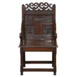 A Charles II oak panel back armchair, Northern England, probably Derbyshire or Lancashire, dated