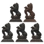 Five Victorian cast iron lion door stops, 38cm h One severely rust-pitted