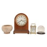 An inlaid mahogany mantle clock, early 20th c, with arch top and gilt metal mounted enamelled