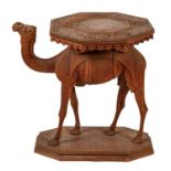 An Anglo-Indian carved teak occasional table in the form of a camel, early 20th c, with octagonal