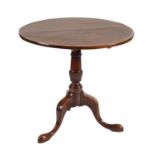 A Victorian mahogany tilt-top tripod table, on turned reeded column, 74cm h; 78cm diam