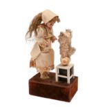 A French bisque headed musical automaton, almost certainly by Renou, late 19th c, with closed