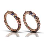 A pair of gem set gold and enamel bangles (Kada), North India, 6cm (internal), 186.6g .Good
