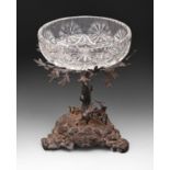 An Elizabeth II silver fruit stand, in the form of an oak tree with the figures of three playful