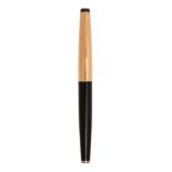 A Mont Blanc gold plated and black vulcanised fountain pen, No 72 .Old dried ink and light to