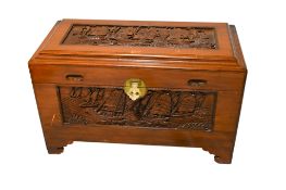A Chinese carved camphor wood trunk.