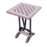 A contemporary Anglo-Indian style chess board on a stand.