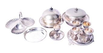A small group of silverplated tableware. Including an egg cup stand, lidded serving dishes, etc.