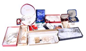 Two boxes of assorted silver and costume jewellery.