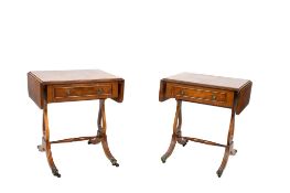 A pair of 20th century Regency style burr walnut veneer drop leaf side tables.