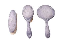 An early 20th century silver backed dressing table set.