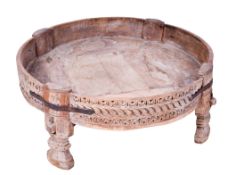A circular wooden coffee table.