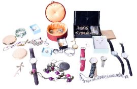 A collection of costume jewellery and wristwatches.