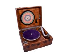 A 20th century portable gramophone. In an oak case with latches, L34cm.