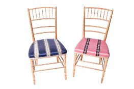 Two gilt bamboo framed chairs.