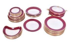 A red and gilt Simpsons Ambassador Ware dinner service.