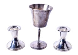 Three pieces of silver and white metal.