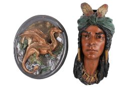 Two contemporary moulded wall plaques.