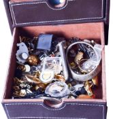 A quantity of costume jewellery and wristwatches in three brown jewellery boxes.