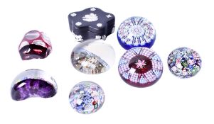 A collection of glass paperweights and a Wedgwood jasperware box.