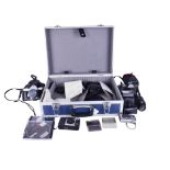 A collection of assorted photographic film and digital cameras with accessories.