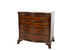 A 20th century Georgian style cross banded mahogany serpentine chest of drawers.