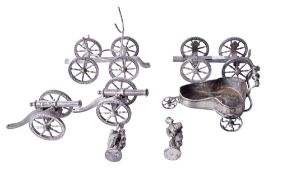 An assortment of novelty silverplated models. Including a model chariot, guns, figures, etc.