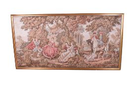 A large French rococo style machine made tapestry. Depicting figures in a classical garden.