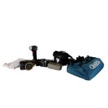 An assortment of cameras, binoculars and tools.