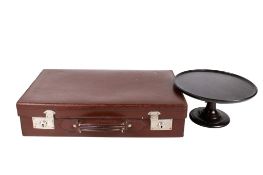 A gentleman's vintage brown leather suitcase and a mahogany centre piece. Max. H15cm. (2).