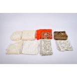 A collection of assorted vintage table linen. Including lace table cloths, lace doilies, etc.